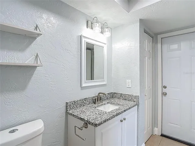 a bathroom with a shower and a toilet
