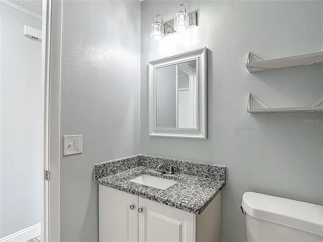 a bathroom with a bathtub and a toilet