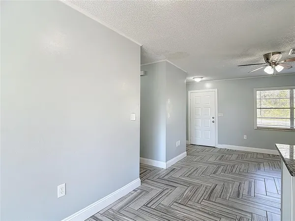 a view of a living room and floor to ceiling window