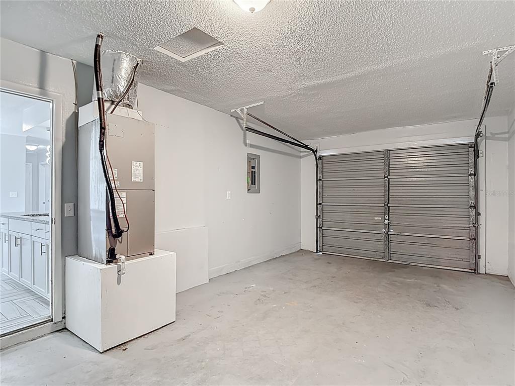 13156 Odham Street Spring Hill, FL 34609 - Photo 37 of 54 a view of a livingroom with closet and cabinet