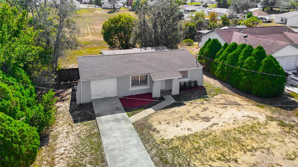 13156 Odham Street Spring Hill, FL 34609 - Photo 44 of 54 an aerial view of a house with a yard