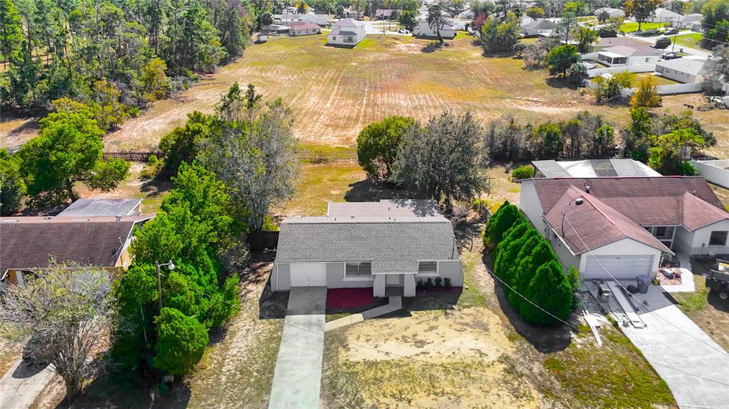 13156 Odham Street Spring Hill, FL 34609 - Photo 45 of 54 an aerial view of a house with swimming pool and ocean view
