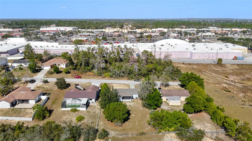 13156 Odham Street Spring Hill, FL 34609 - Photo 47 of 54 an aerial view of residential houses with outdoor space