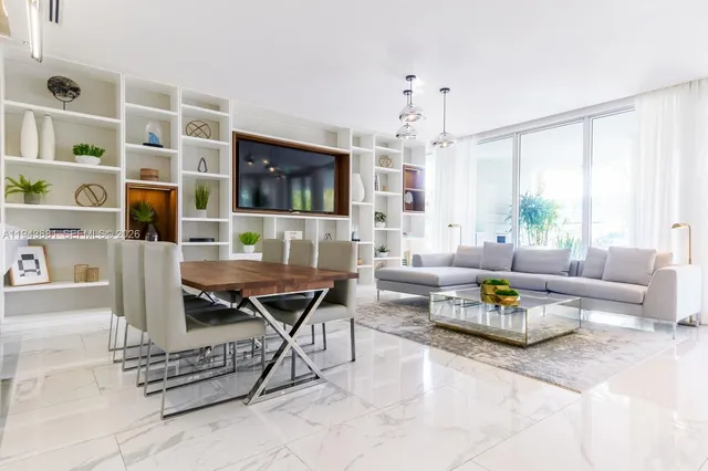 a view of swimming pool with outdoor seating and plants