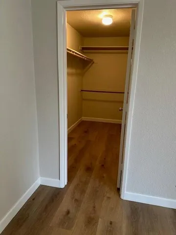 an empty room with wooden floor