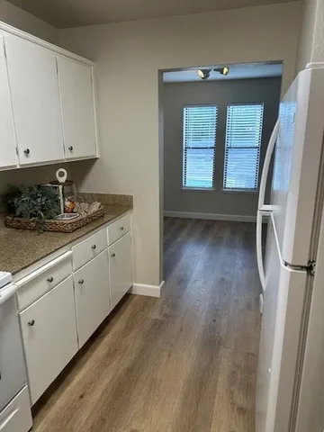 a view of entryway with wooden floor