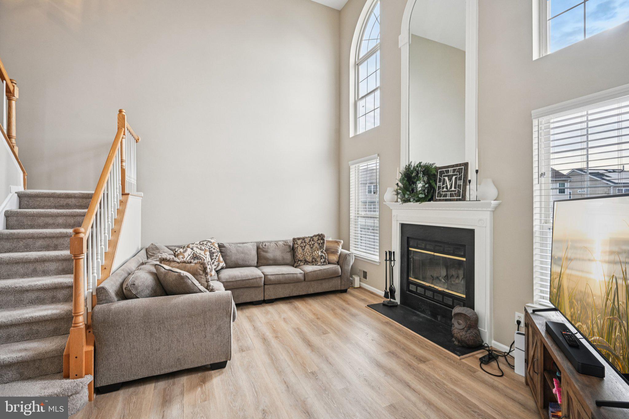4 Cheyenne Court Burlington, NJ 08016 - Photo 11 of 34 a living room with furniture and a fireplace