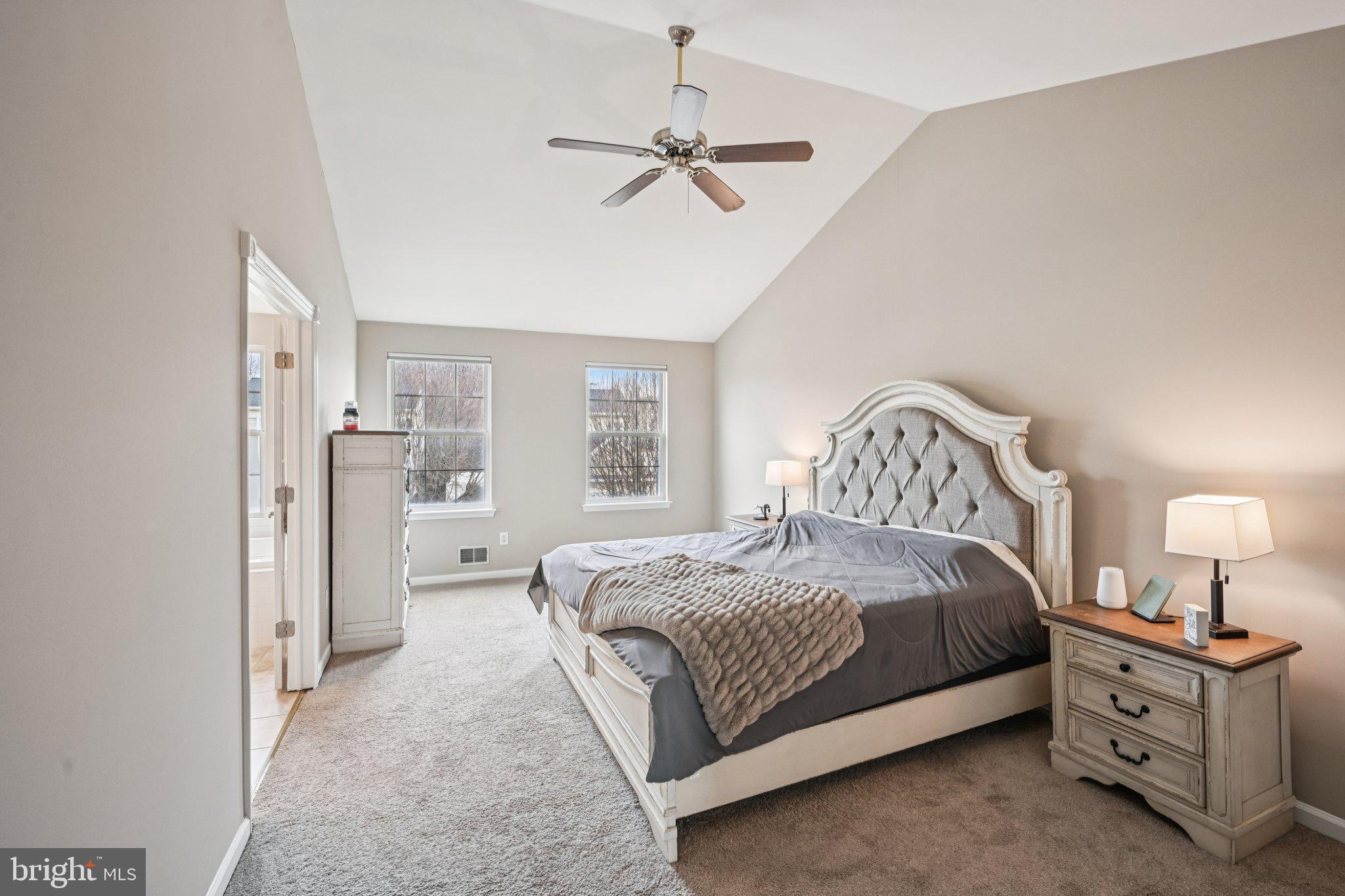 4 Cheyenne Court Burlington, NJ 08016 - Photo 15 of 34 a spacious bedroom with a bed and a chandelier