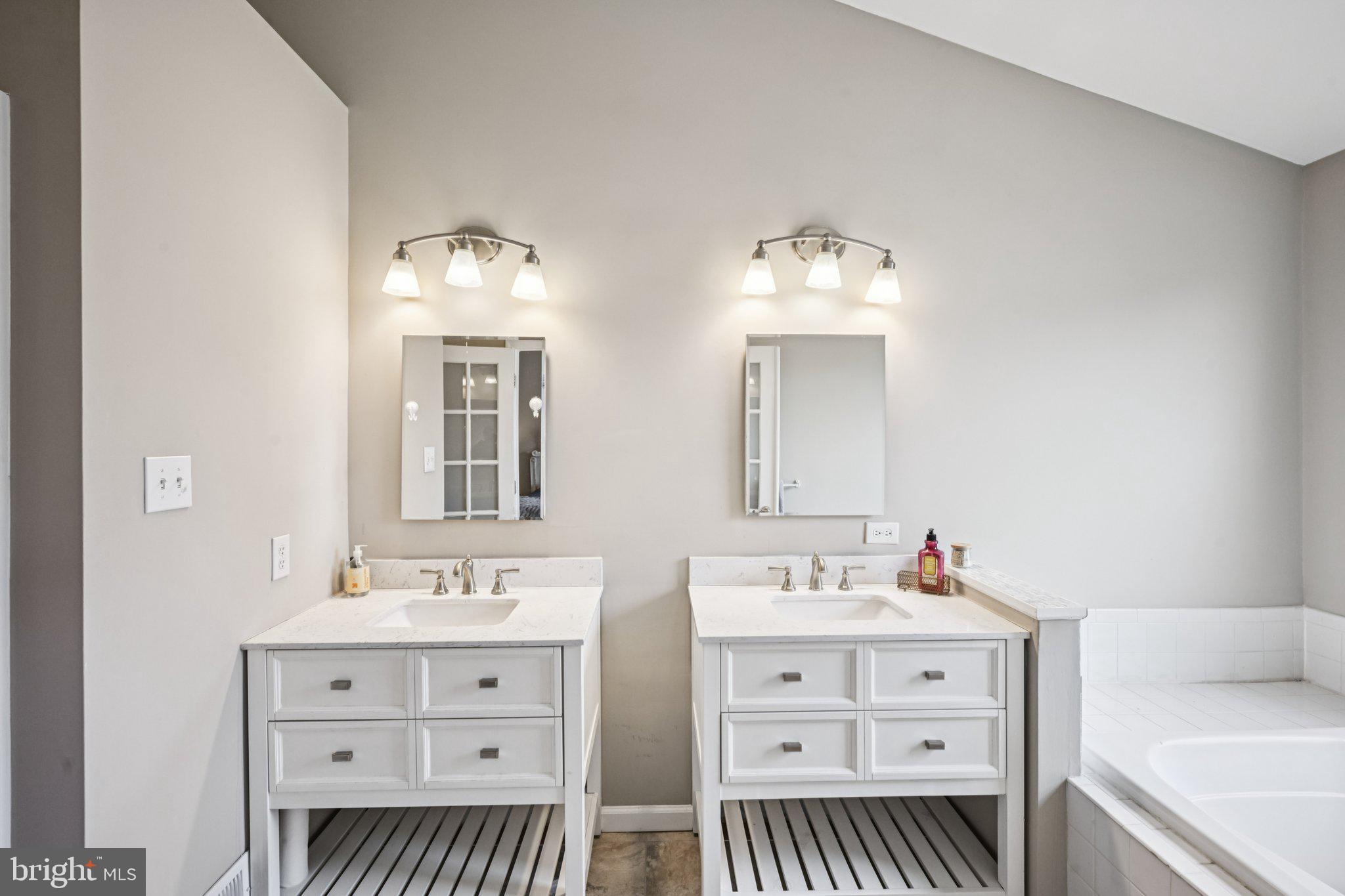 4 Cheyenne Court Burlington, NJ 08016 - Photo 17 of 34 a bathroom with a double vanity sink mirror and bathtub