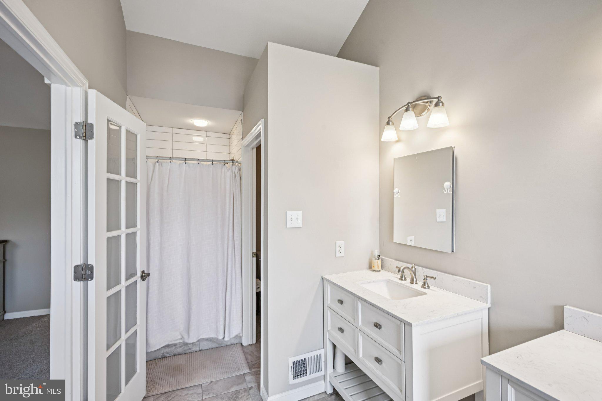 4 Cheyenne Court Burlington, NJ 08016 - Photo 19 of 34 a bathroom with a double vanity sink mirror and