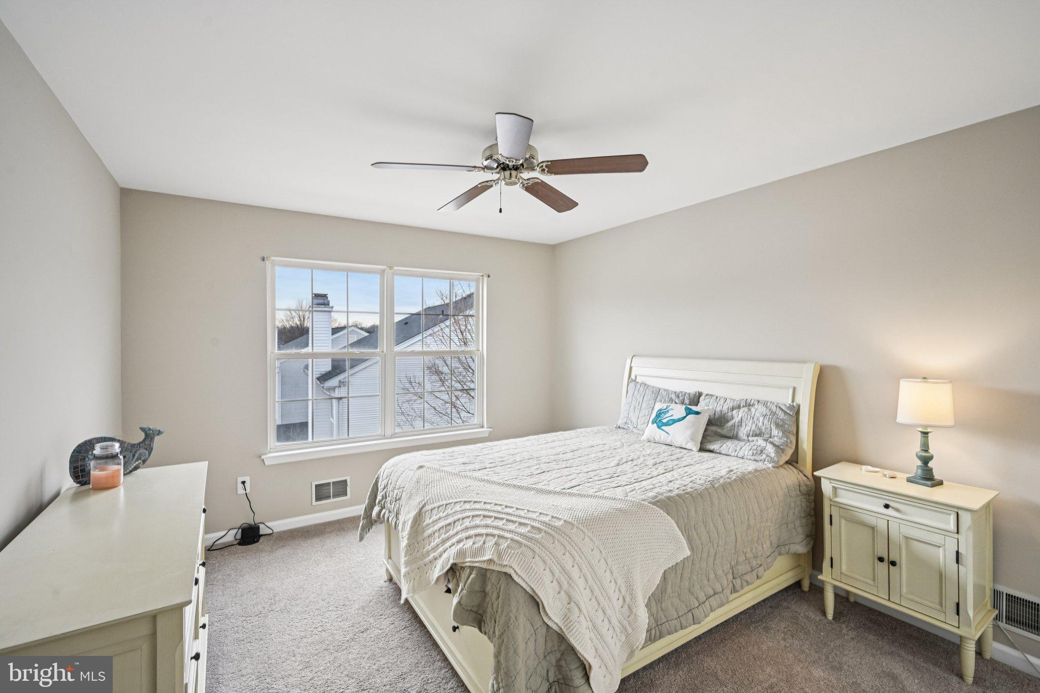 4 Cheyenne Court Burlington, NJ 08016 - Photo 21 of 34 a spacious bedroom with a bed and a chandelier