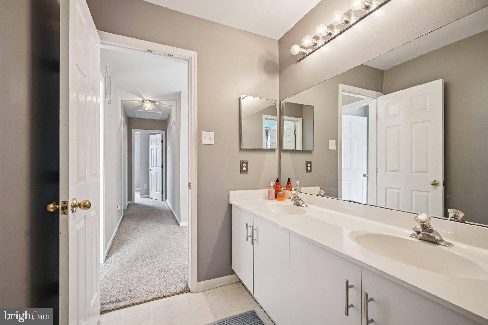 4 Cheyenne Court Burlington, NJ 08016 - Photo 23 of 34 a bathroom with a sink and a mirror