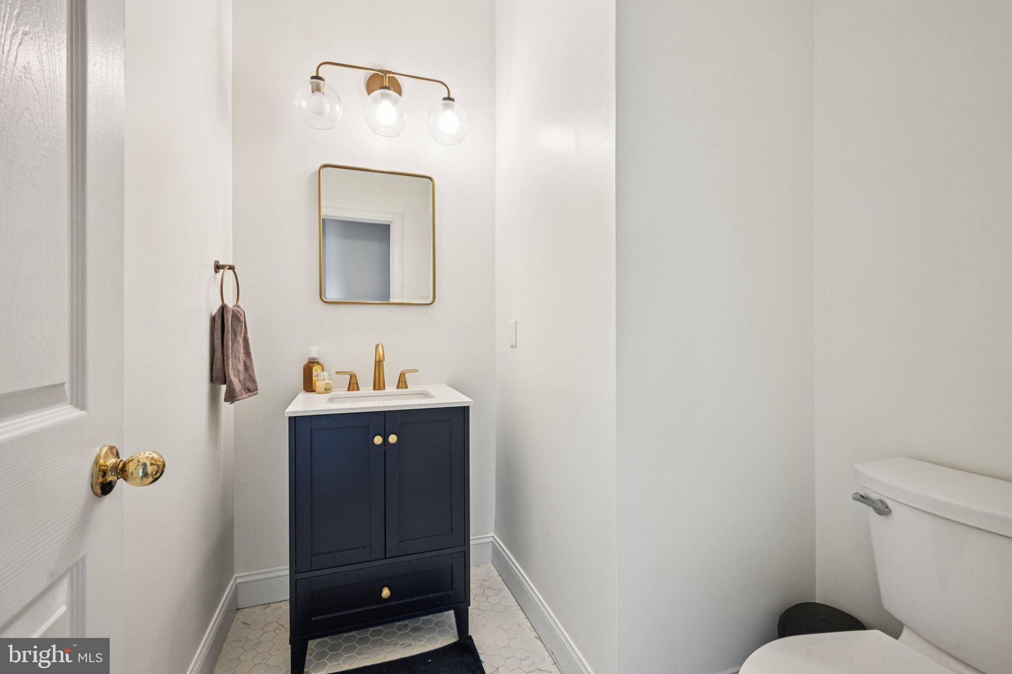 4 Cheyenne Court Burlington, NJ 08016 - Photo 29 of 34 a bathroom with a sink a toilet and mirror