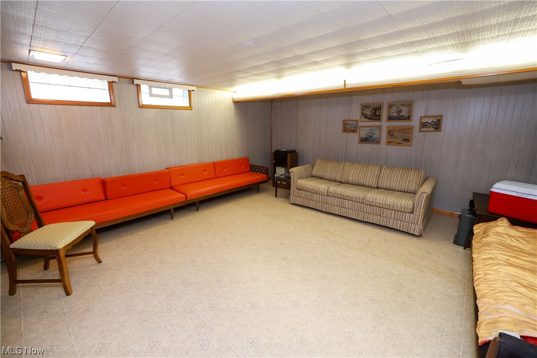 29252 Barjode Road Willowick, OH 44095 - Photo 18 of 21 Living room with light tile flooring and wooden walls