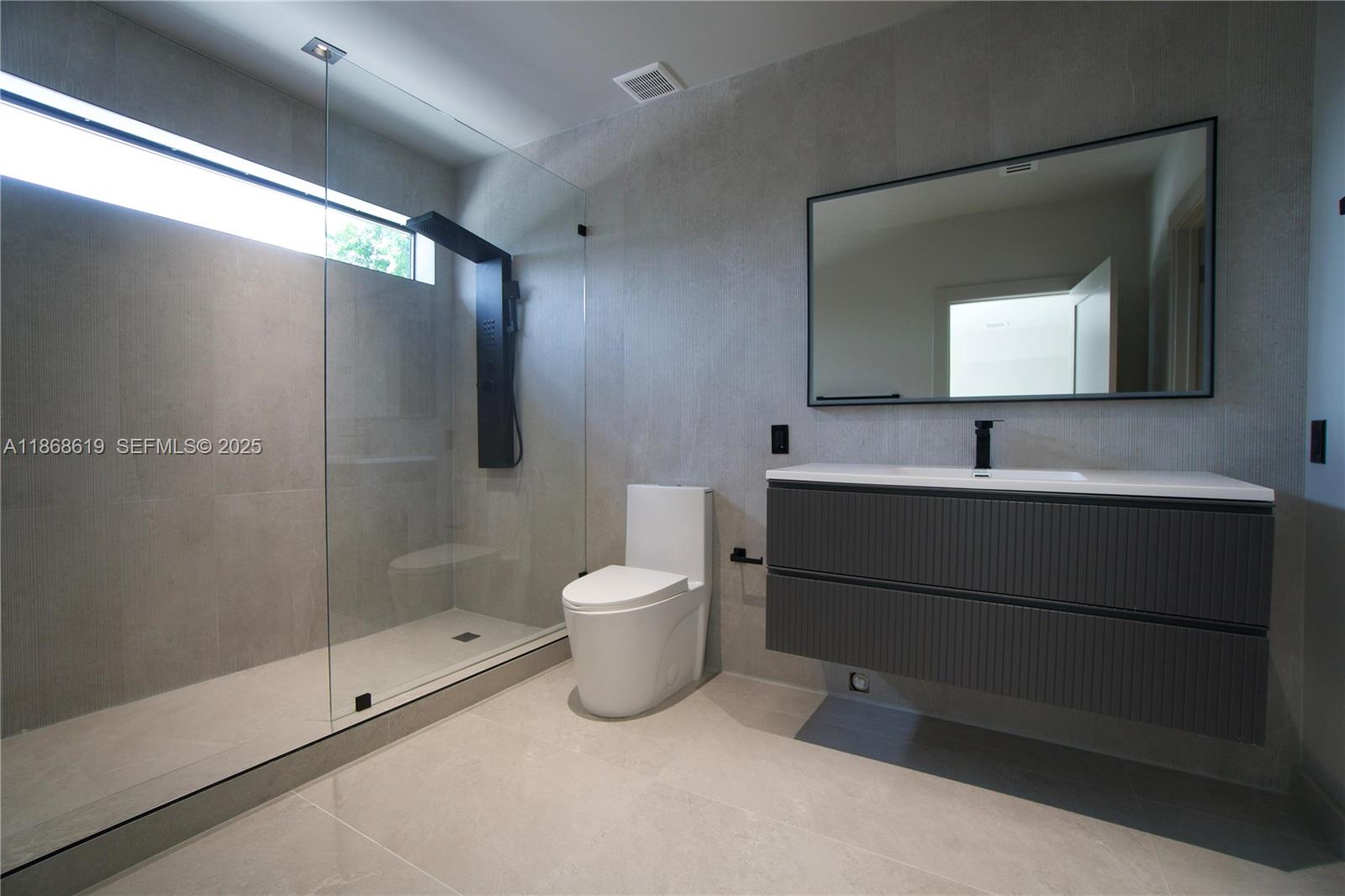 2155 Southwest 25th Terrace Miami, FL 33133 - Photo 11 of 20 a bathroom with a toilet sink and shower