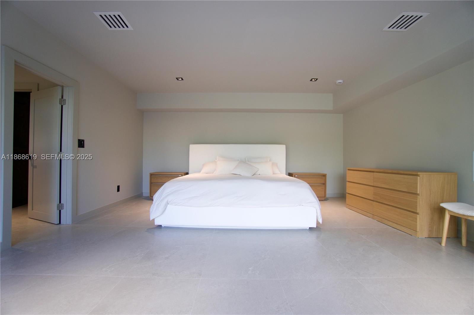 2155 Southwest 25th Terrace Miami, FL 33133 - Photo 12 of 20 a bedroom with a bed and closet