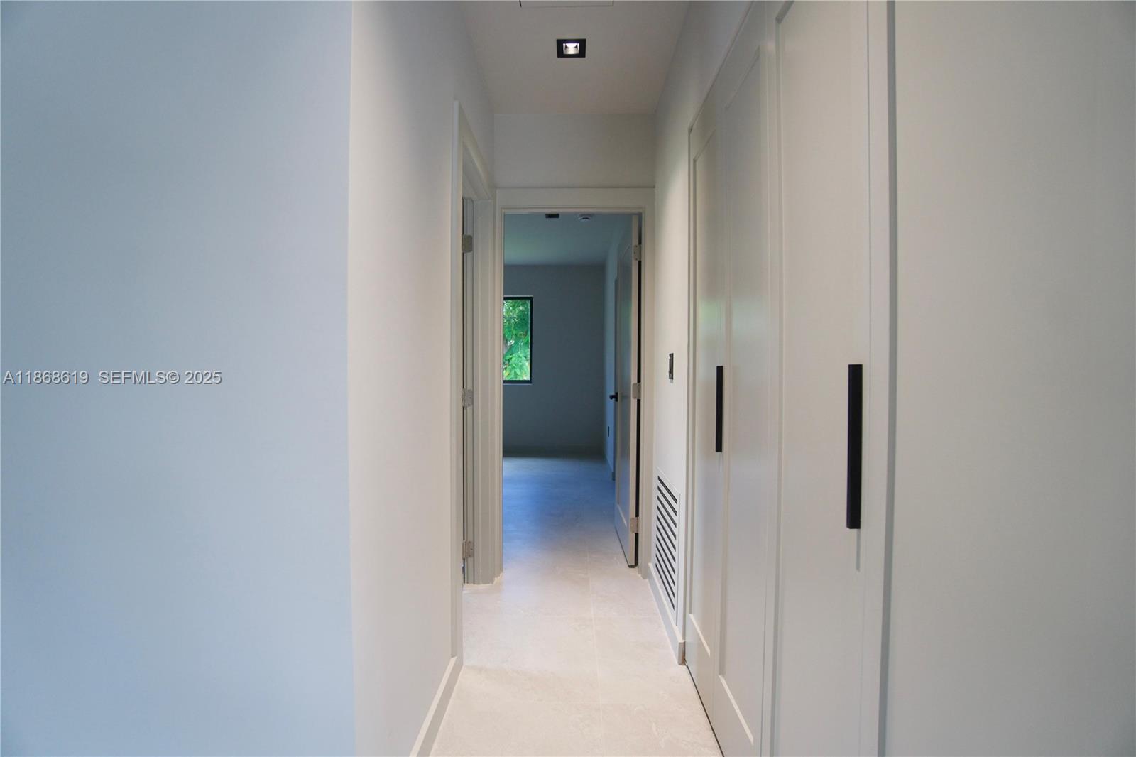 2155 Southwest 25th Terrace Miami, FL 33133 - Photo 14 of 20 a view of a hallway with wooden floor