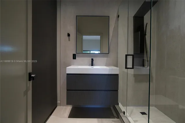 a bathroom with a sink and a mirror