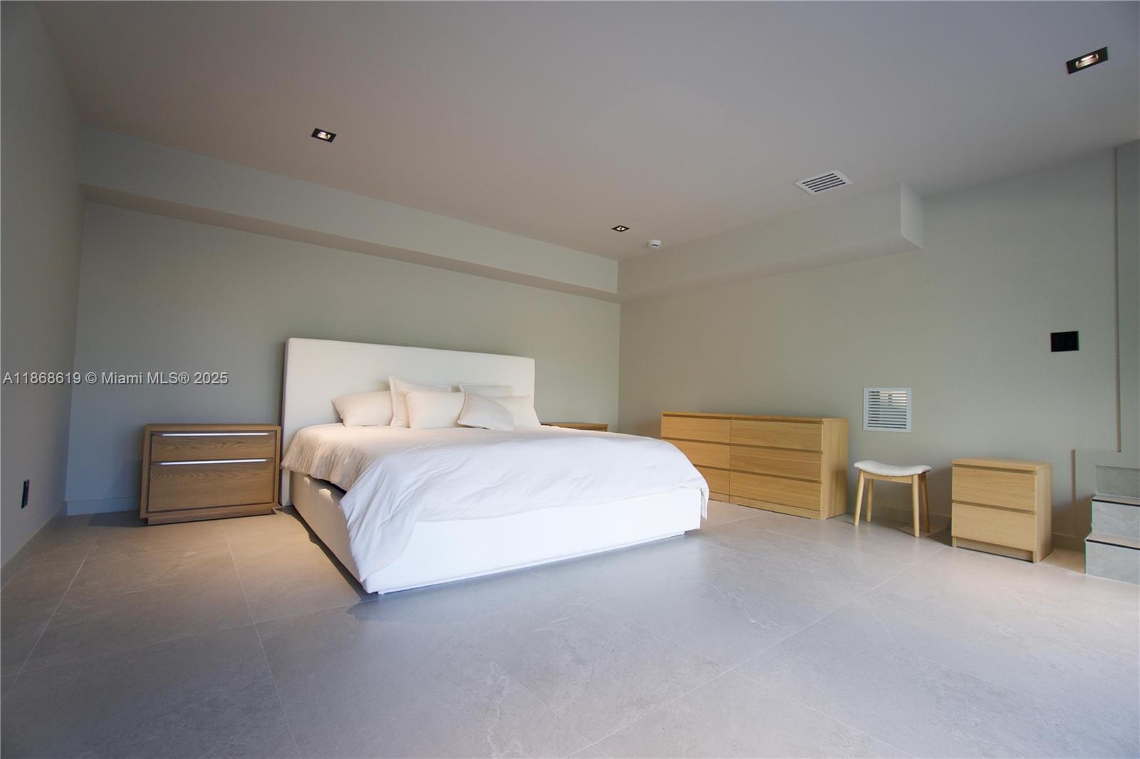 2155 Southwest 25th Terrace Miami, FL 33133 - Photo 7 of 20 a bedroom with a bed and lamp