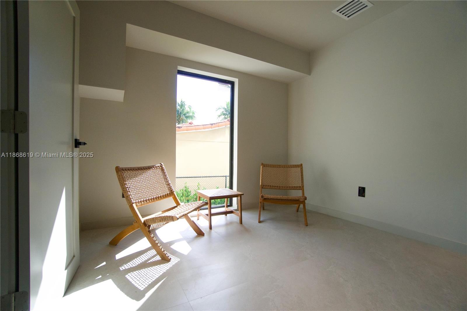 2155 Southwest 25th Terrace Miami, FL 33133 - Photo 8 of 20 a view of a room with lounge chair and windows