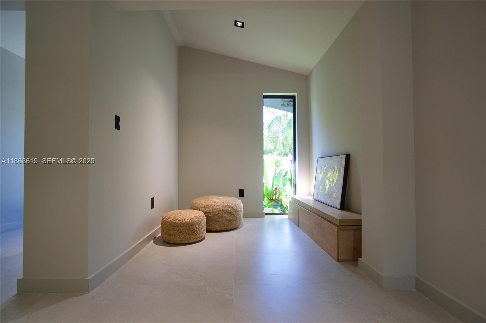 2155 Southwest 25th Terrace Miami, FL 33133 - Photo 10 of 20 a living room with furniture and a flat screen tv