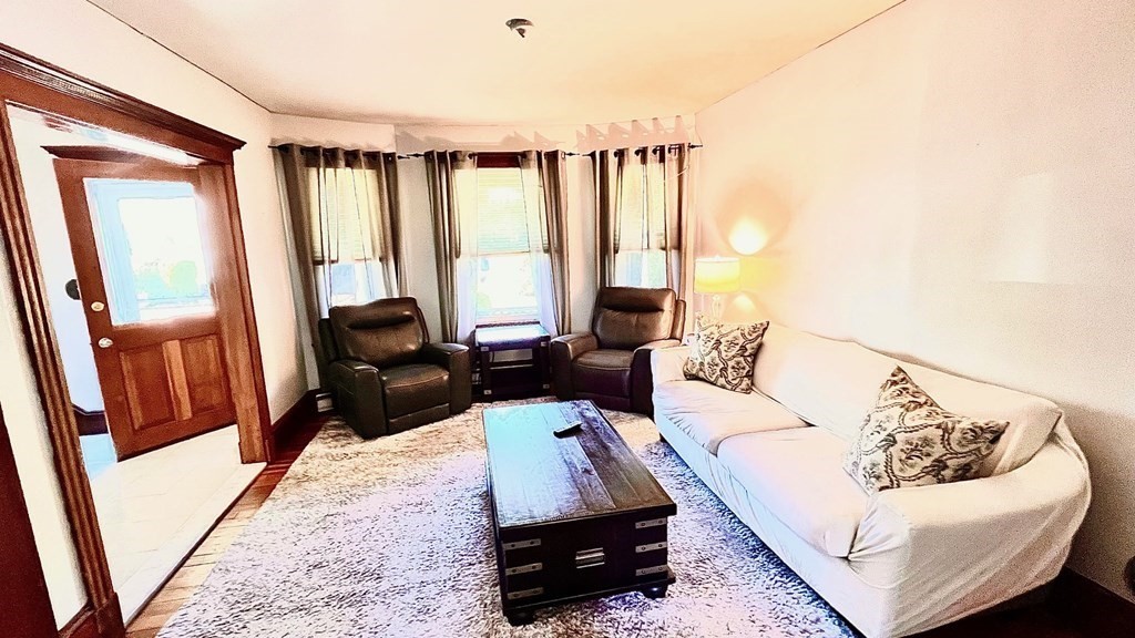 14 Sargent Street Winthrop, MA 02152 - Photo 4 of 17 a living room with furniture and a large window