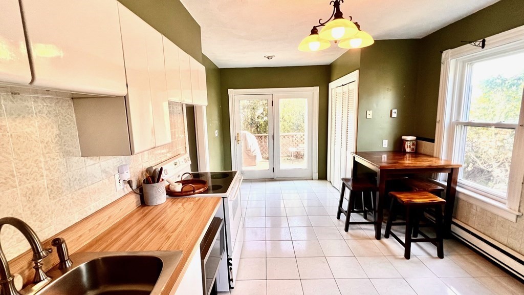 14 Sargent Street Winthrop, MA 02152 - Photo 9 of 17 a bedroom with a bed and a large window