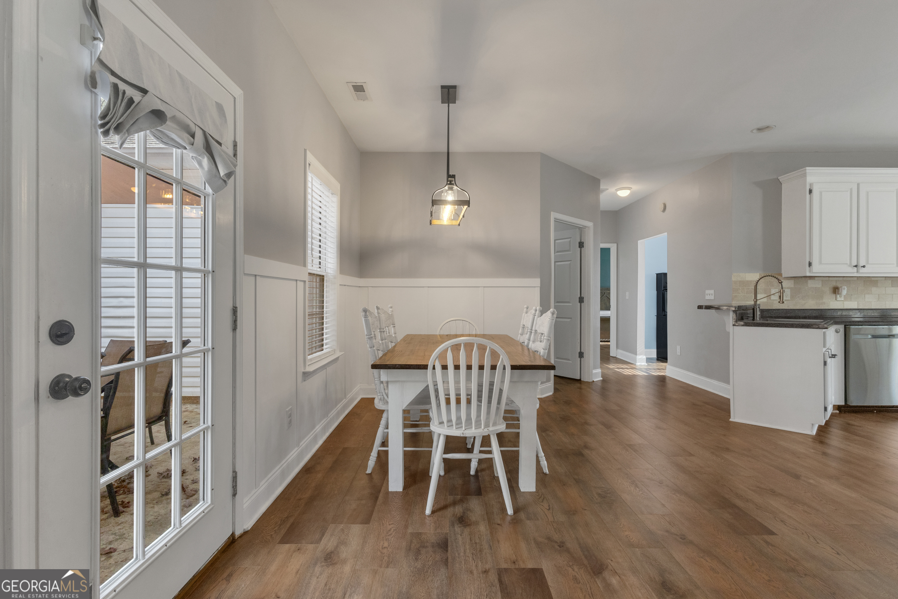 1135 Baptist Camp Road Griffin, GA 30223 - Photo 12 of 54 a view of a dining room with furniture and wooden floor