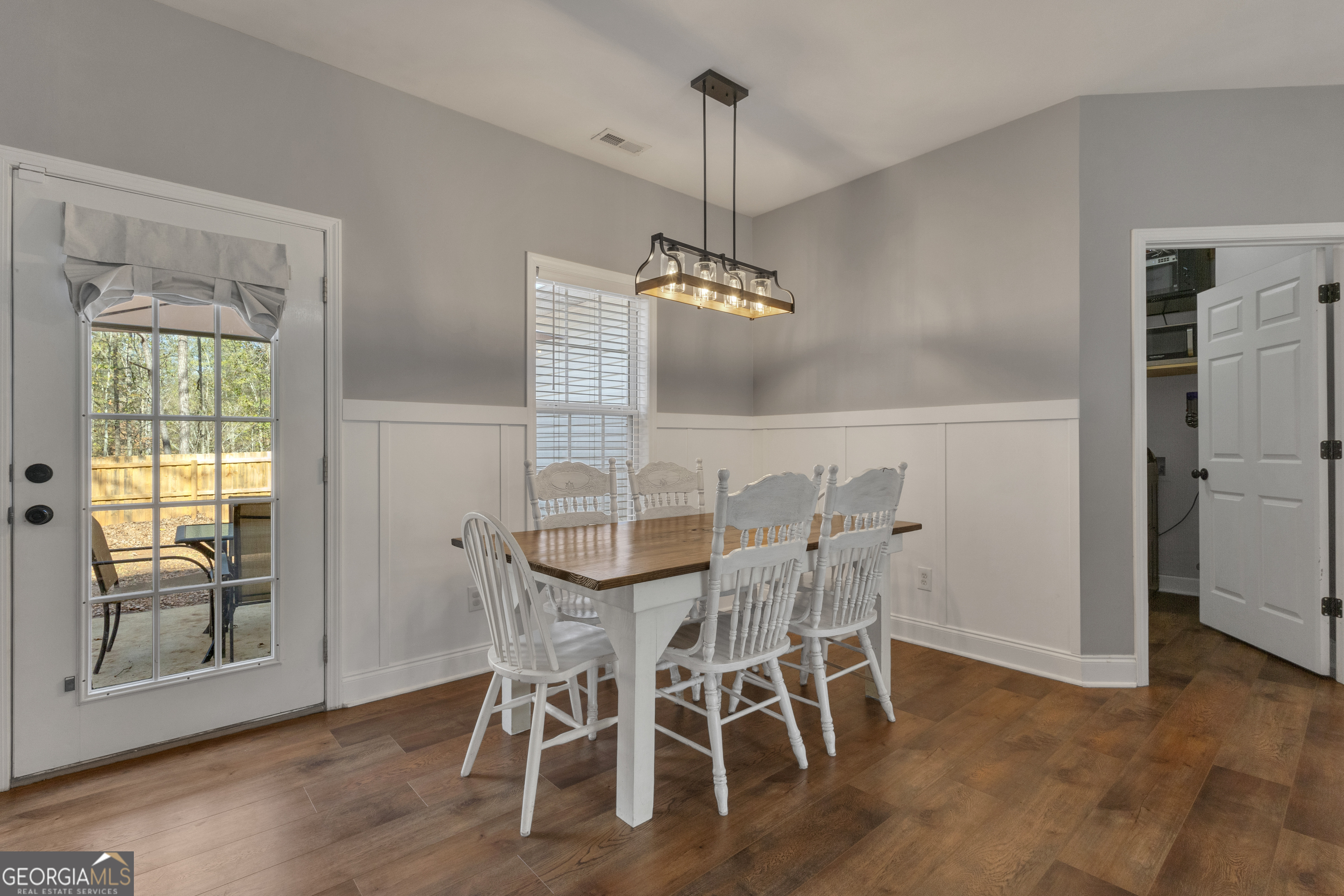 1135 Baptist Camp Road Griffin, GA 30223 - Photo 13 of 54 a view of a dining room with furniture window and wooden floor