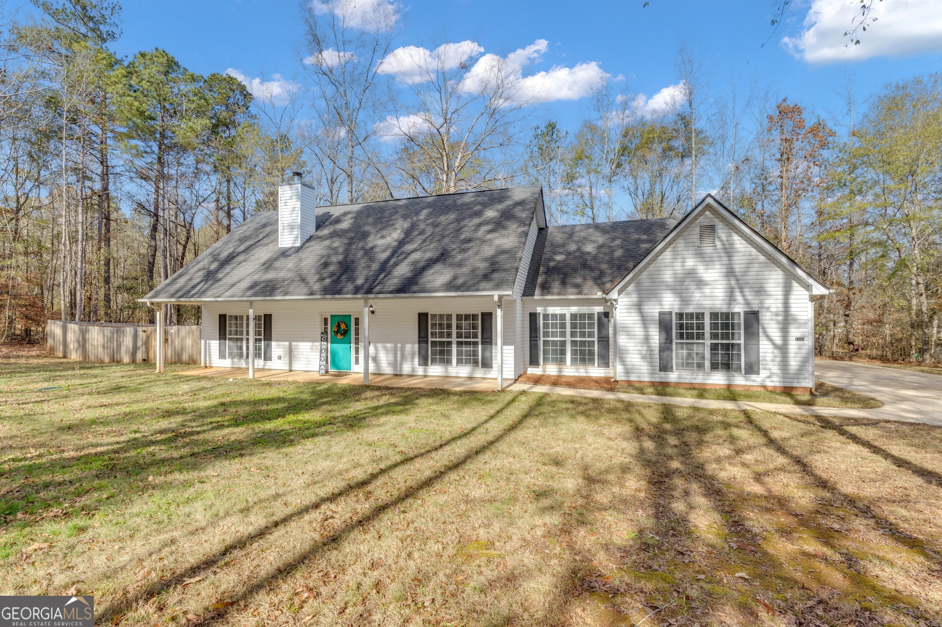 1135 Baptist Camp Road Griffin, GA 30223 - Photo 2 of 54 a front view of a house with a garden