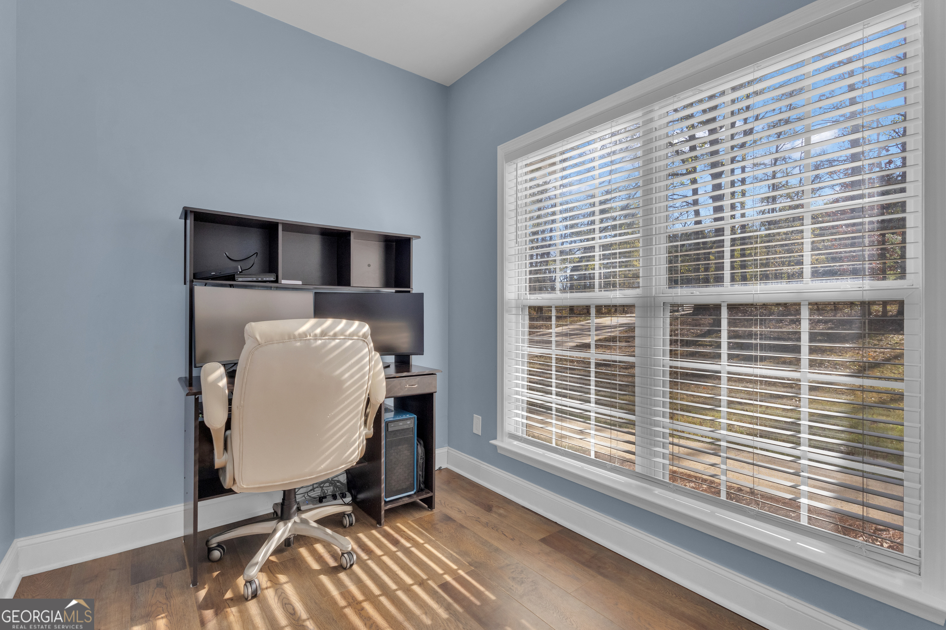 1135 Baptist Camp Road Griffin, GA 30223 - Photo 22 of 54 a view of a workspace with furniture and a window