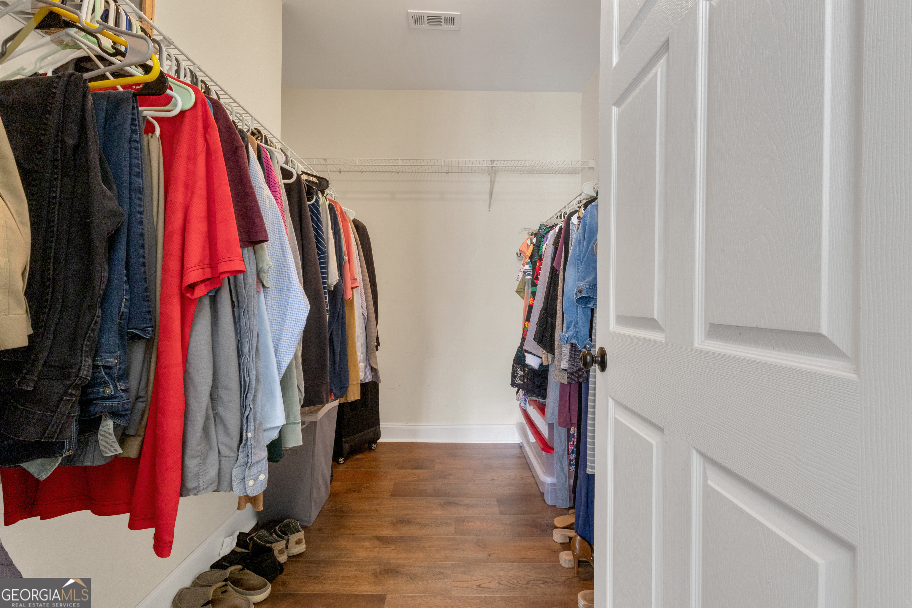 1135 Baptist Camp Road Griffin, GA 30223 - Photo 28 of 54 a view of walk in closet with clothes and shoes