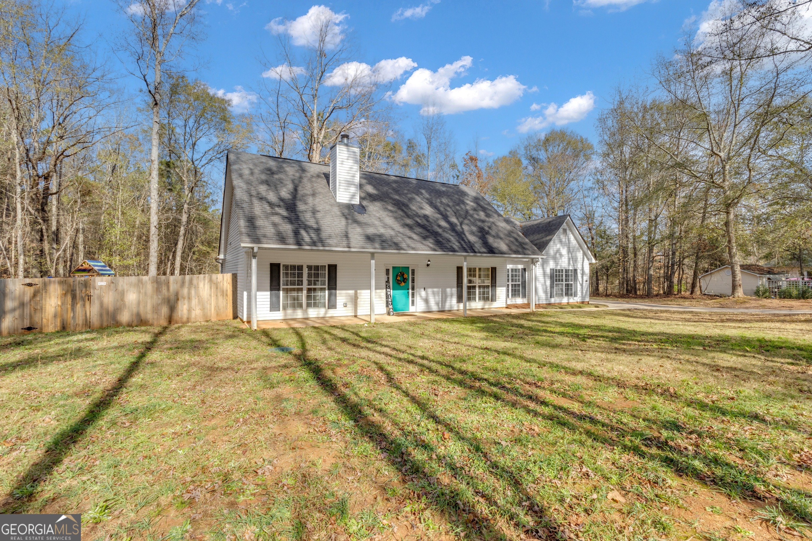 1135 Baptist Camp Road Griffin, GA 30223 - Photo 3 of 54 a front view of a house with a yard