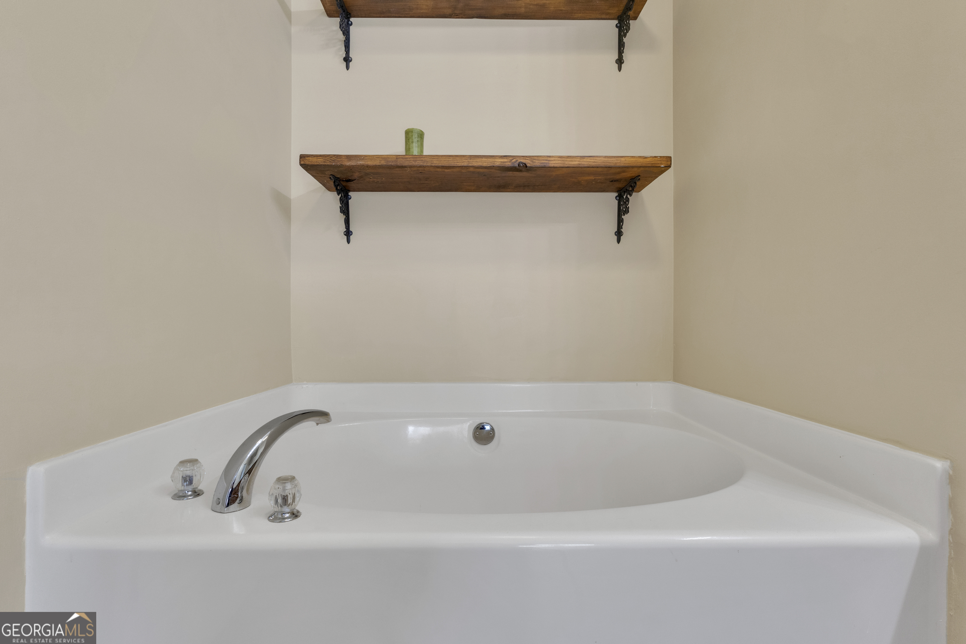 1135 Baptist Camp Road Griffin, GA 30223 - Photo 31 of 54 a bathroom with a bathtub
