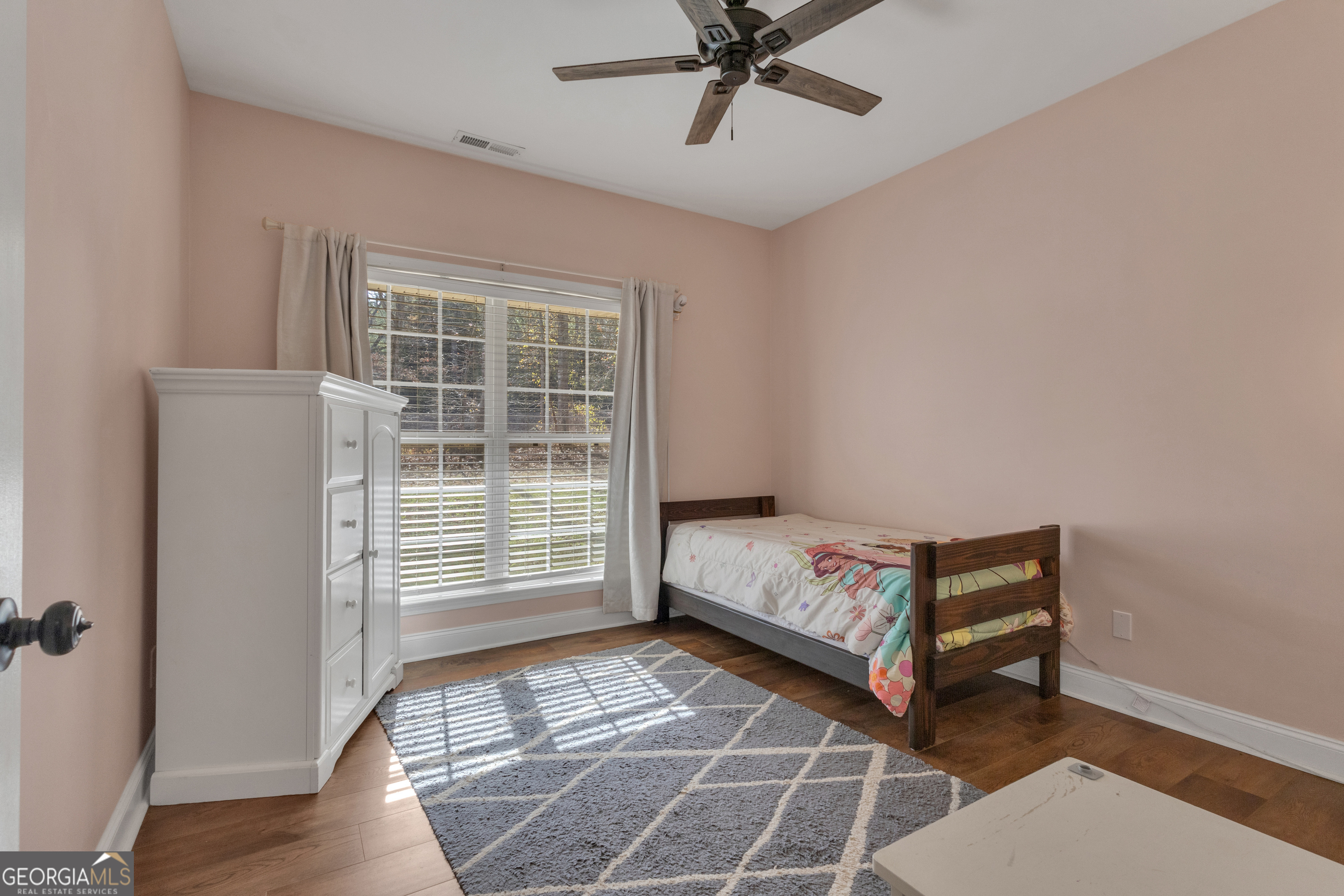 1135 Baptist Camp Road Griffin, GA 30223 - Photo 32 of 54 a bedroom with a bed and a window