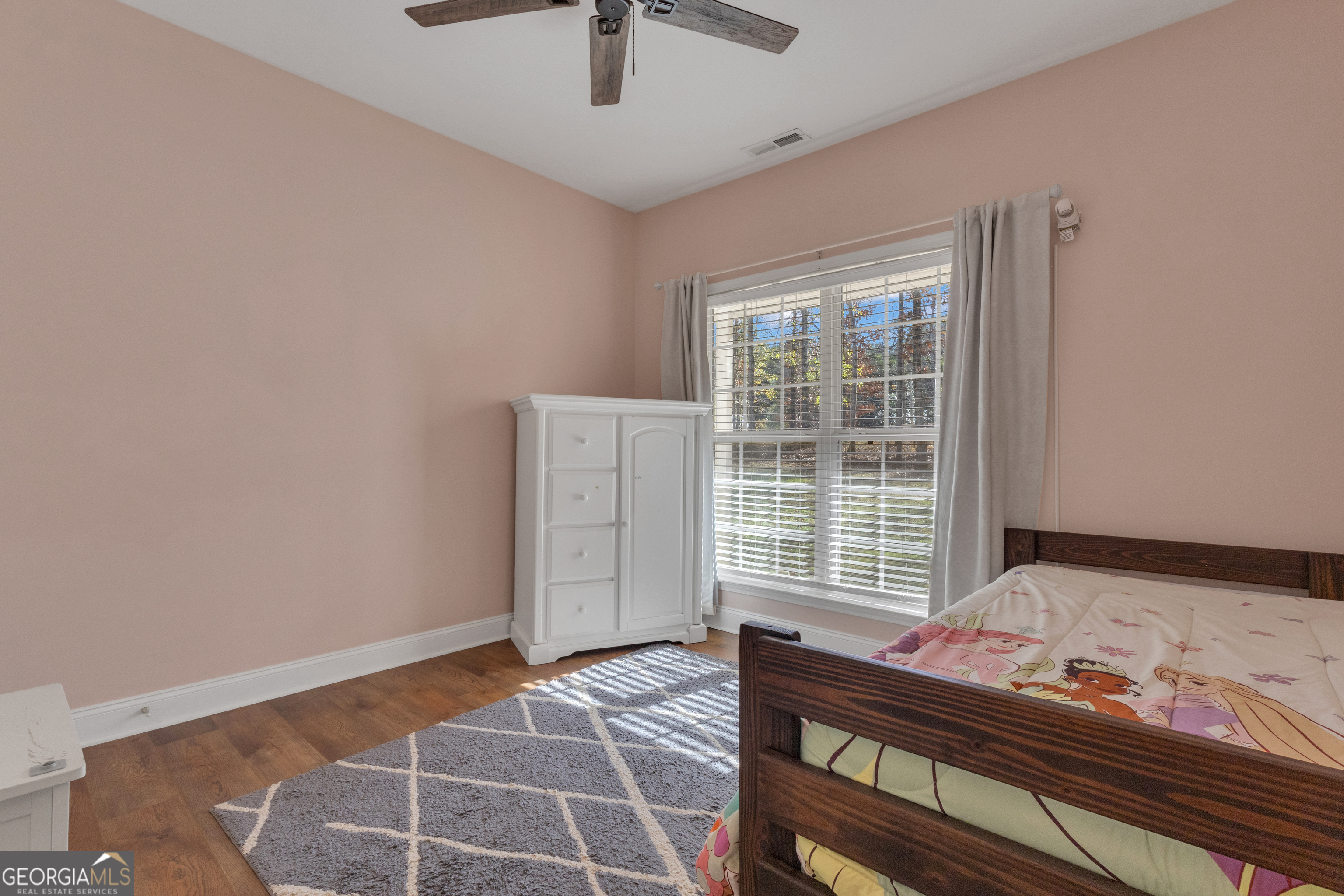 1135 Baptist Camp Road Griffin, GA 30223 - Photo 34 of 54 a bedroom with a bed and a window