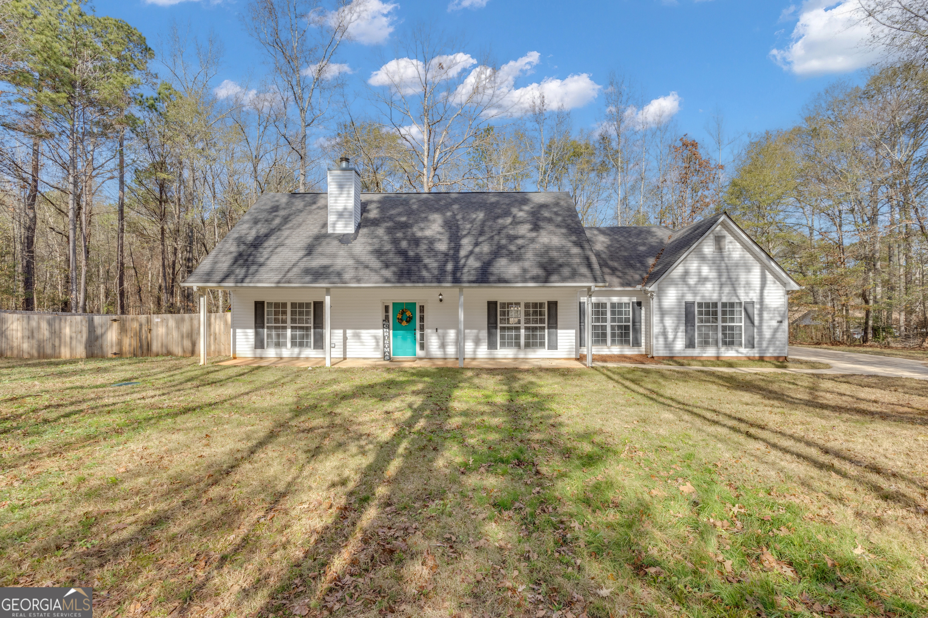 1135 Baptist Camp Road Griffin, GA 30223 - Photo 4 of 54 a front view of a house with a yard