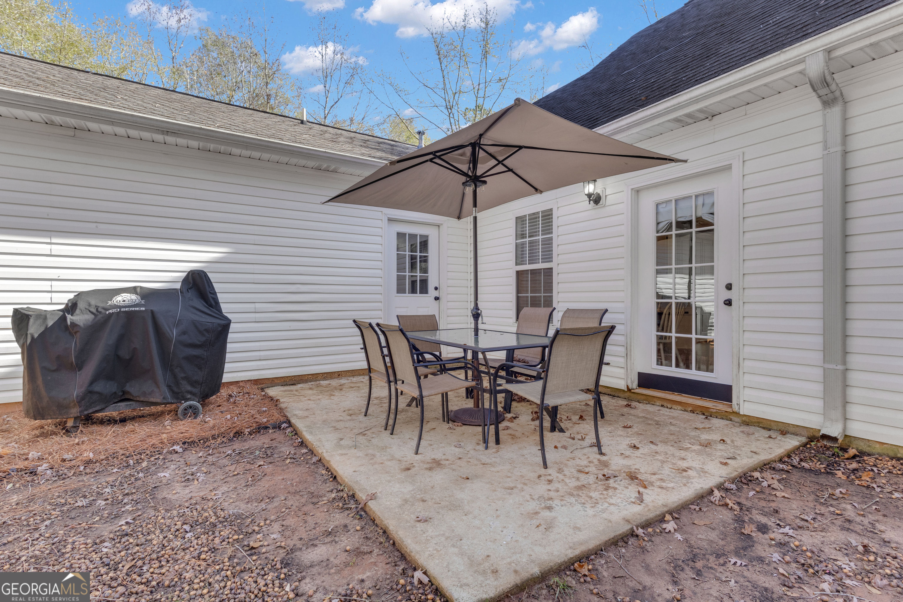1135 Baptist Camp Road Griffin, GA 30223 - Photo 41 of 54 a view of a chairs and table in the patio