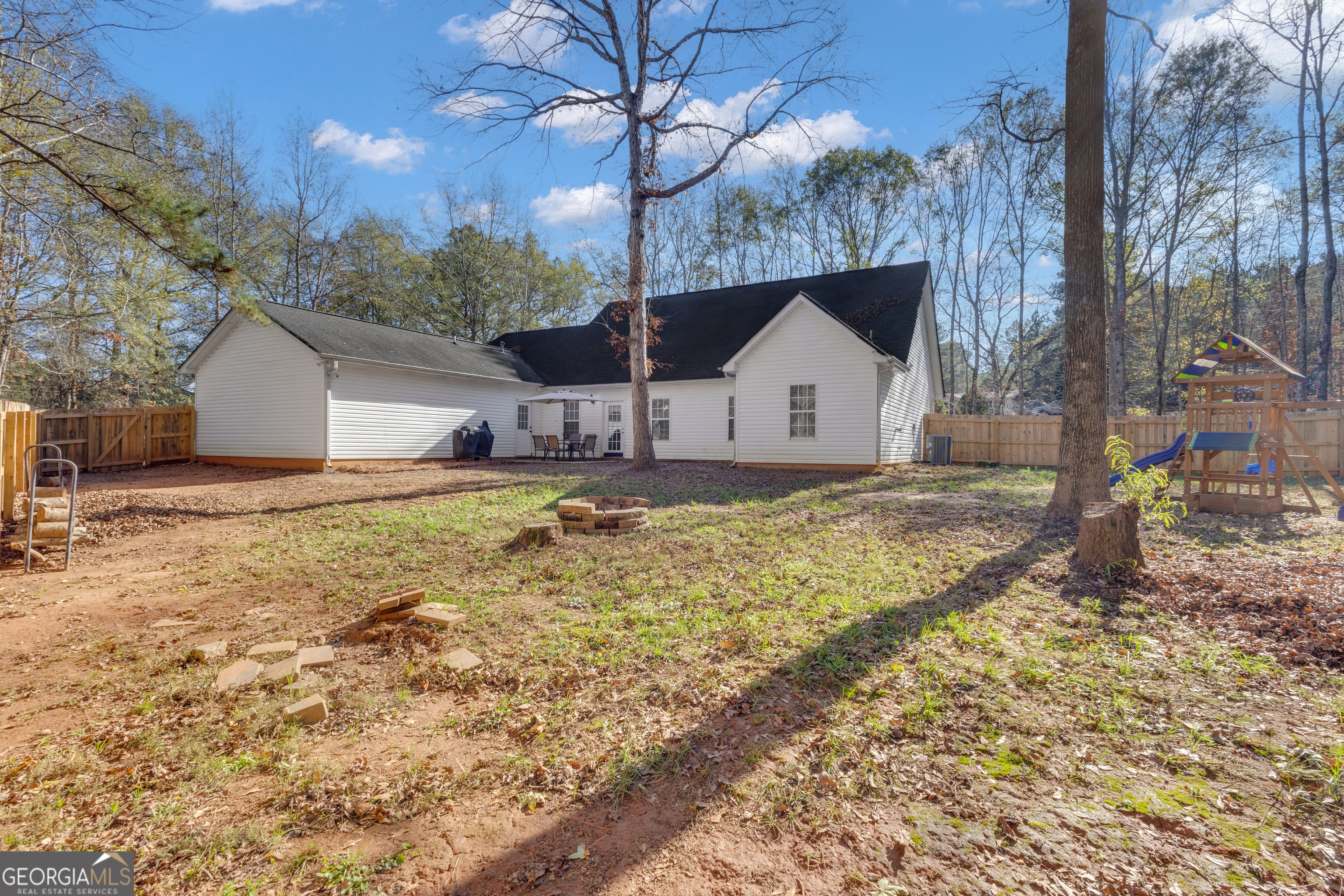 1135 Baptist Camp Road Griffin, GA 30223 - Photo 45 of 54 a view of a house with a yard