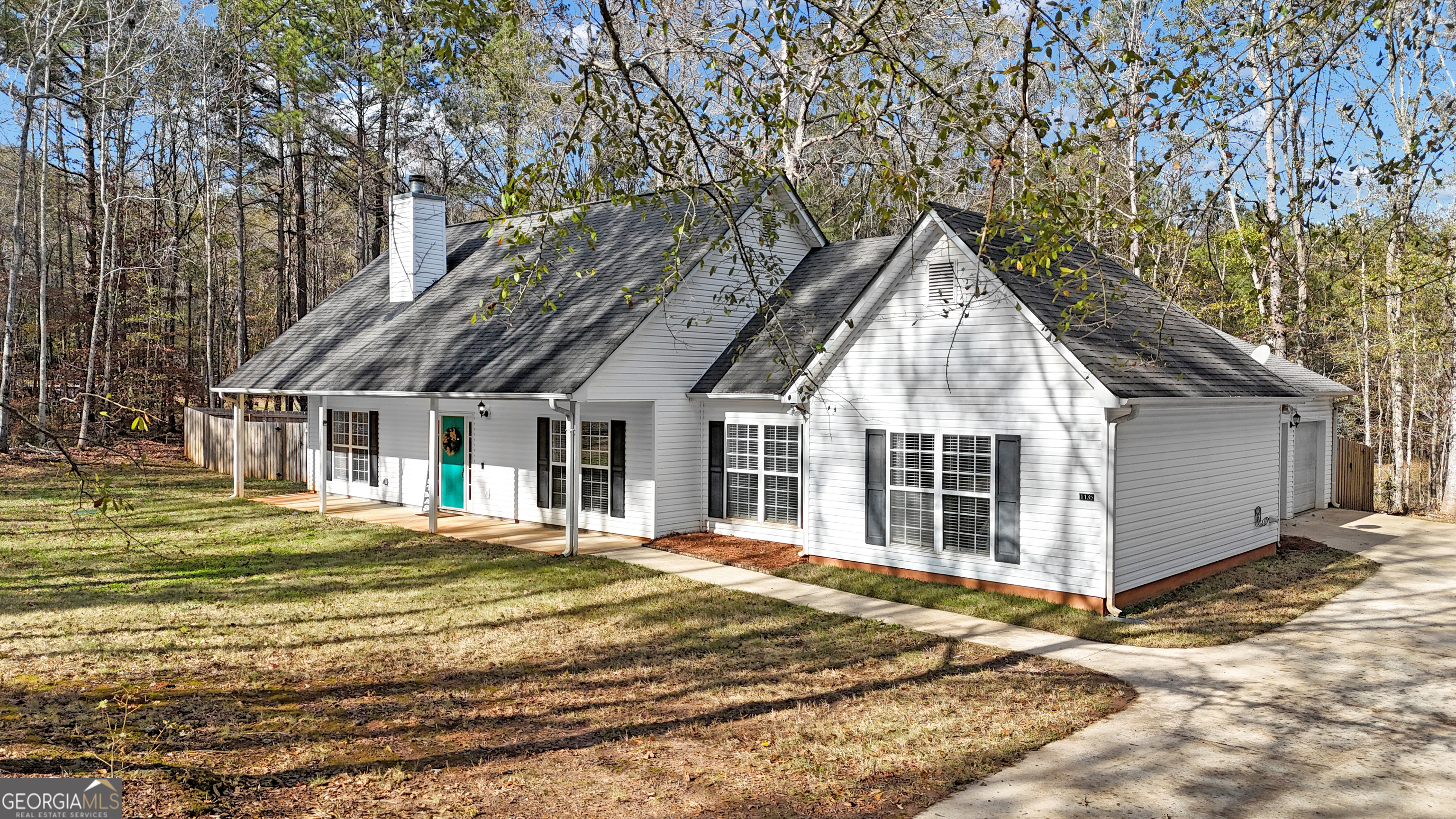 1135 Baptist Camp Road Griffin, GA 30223 - Photo 49 of 54 a front view of a house with a yard