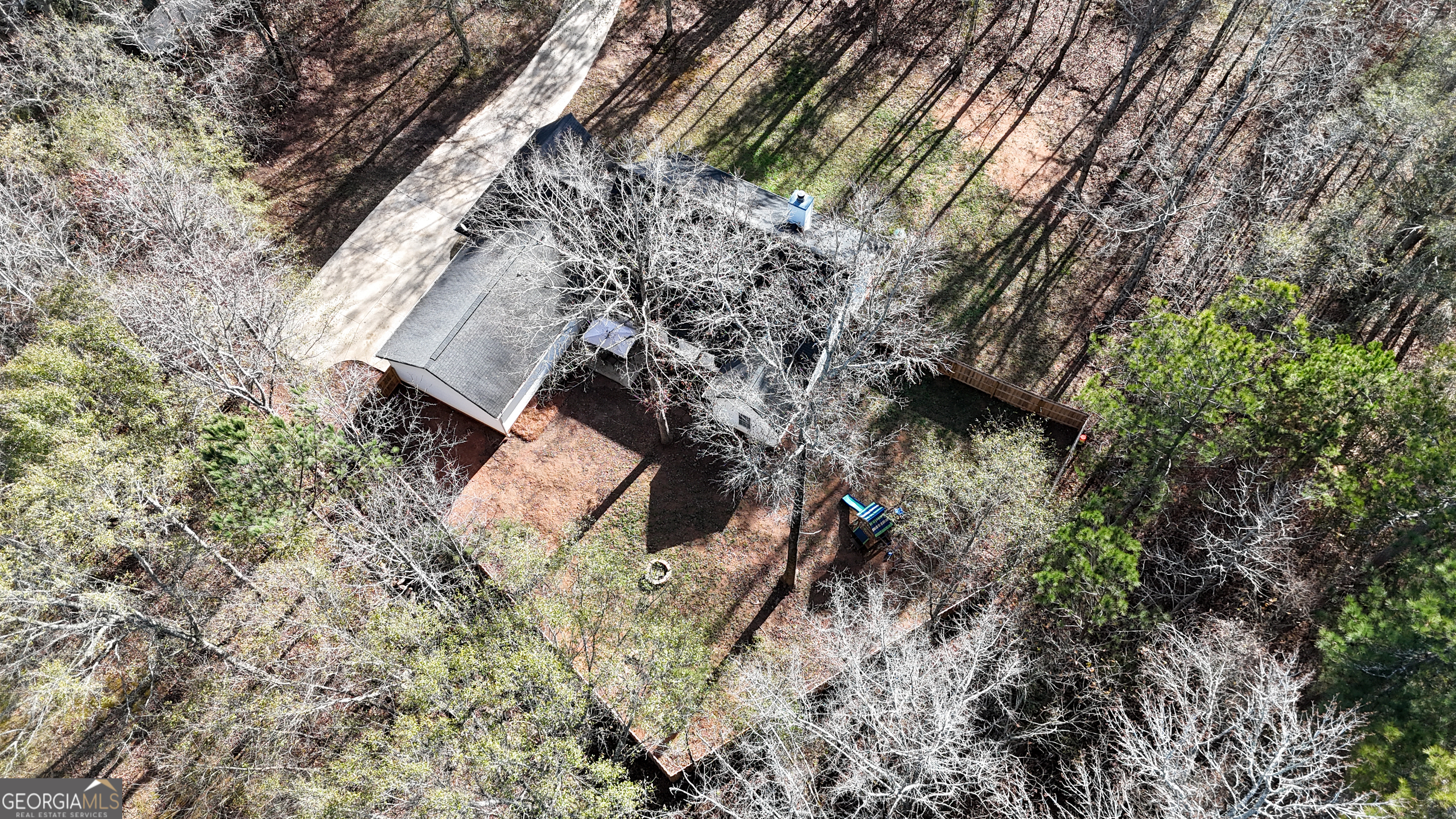 1135 Baptist Camp Road Griffin, GA 30223 - Photo 53 of 54 a backyard of a house with lots of green space