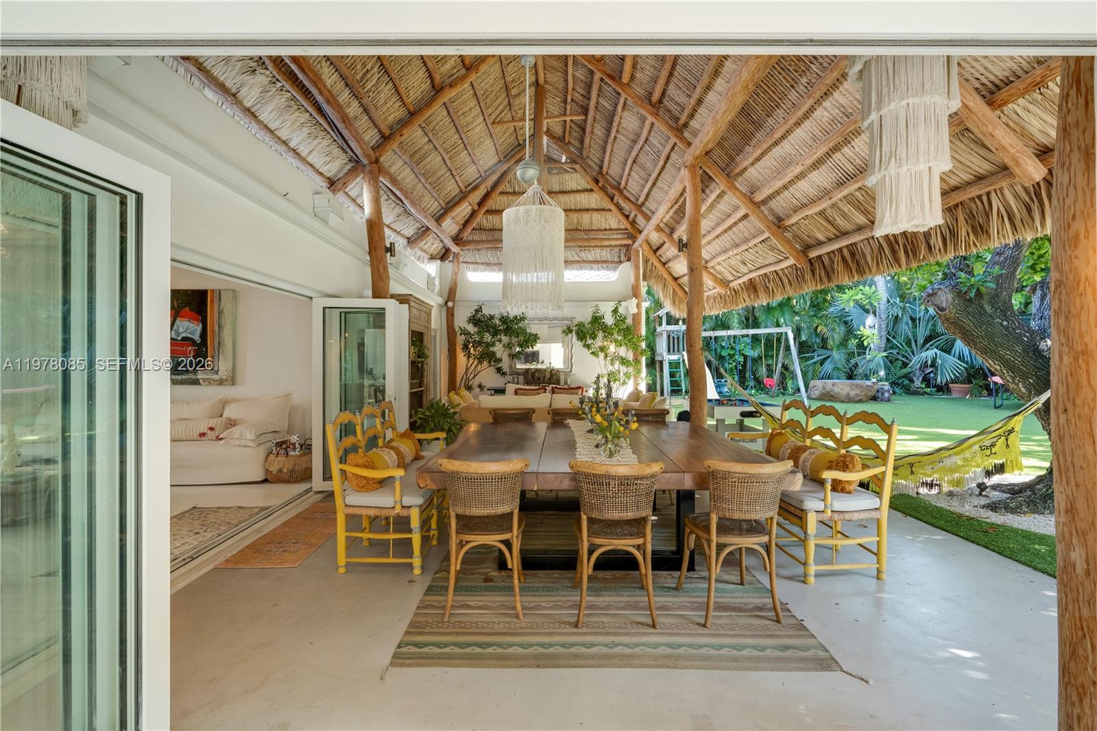 330 Gulf Road Key Biscayne, FL 33149 - Photo 13 of 46 a dining room with furniture and a floor to ceiling window
