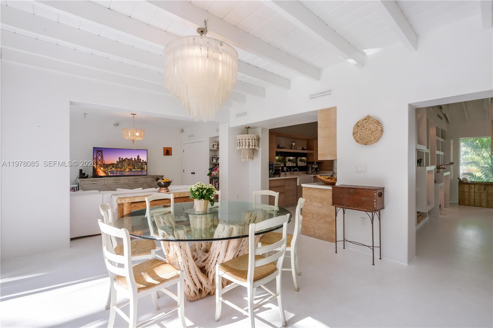 330 Gulf Road Key Biscayne, FL 33149 - Photo 14 of 46 a view of a dining room with furniture and a kitchen