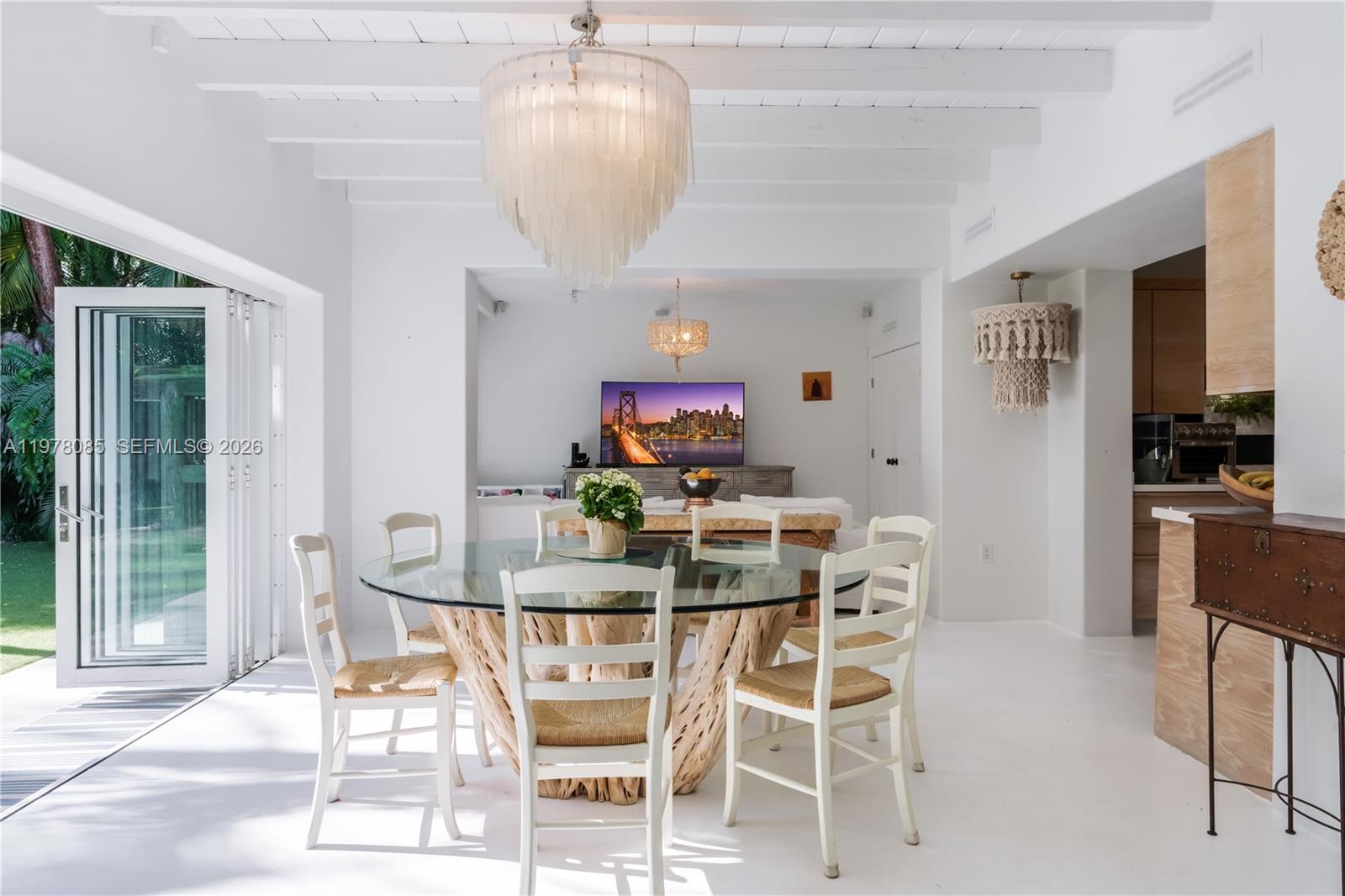 330 Gulf Road Key Biscayne, FL 33149 - Photo 15 of 46 a view of a dining room with furniture