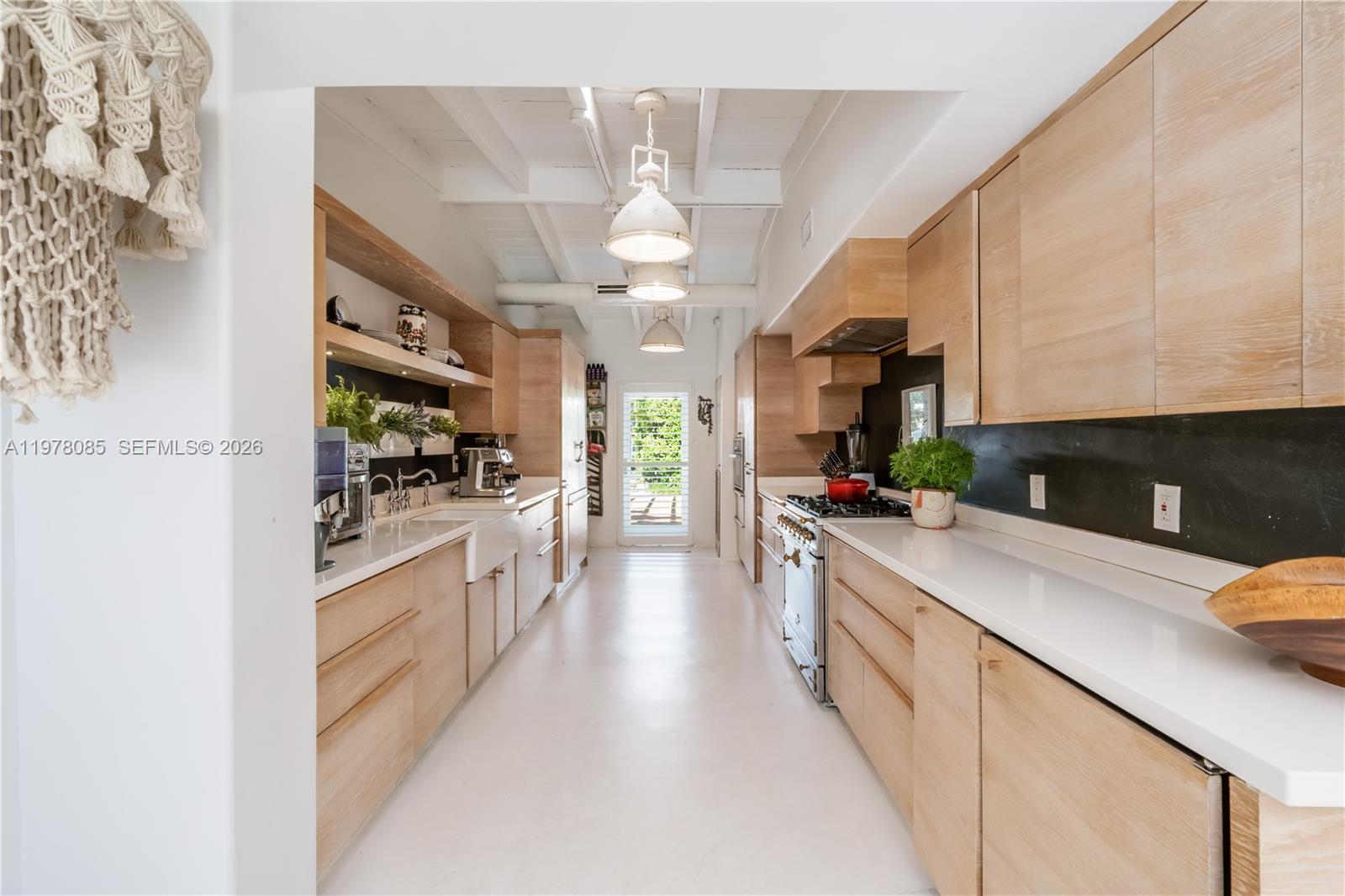 330 Gulf Road Key Biscayne, FL 33149 - Photo 19 of 46 a large kitchen with granite countertop lots of counter space and stainless steel appliances