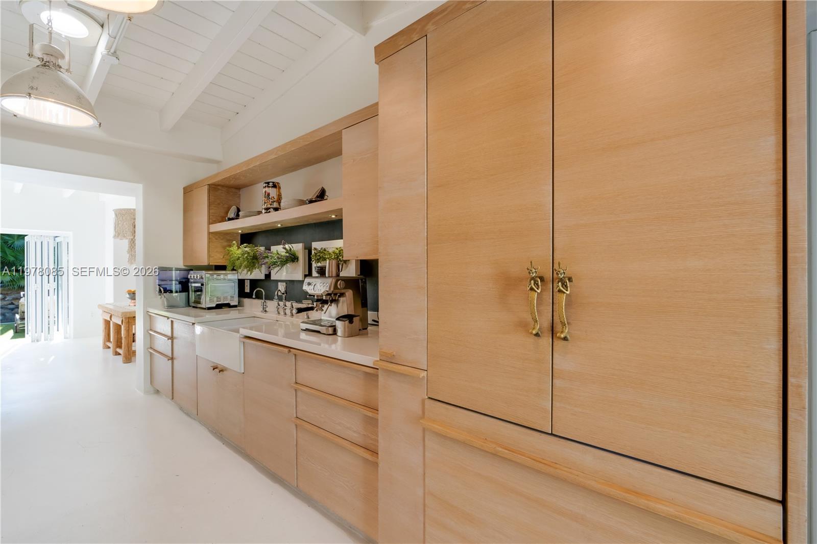 330 Gulf Road Key Biscayne, FL 33149 - Photo 21 of 46 a kitchen with stainless steel appliances granite countertop white cabinets and a refrigerator