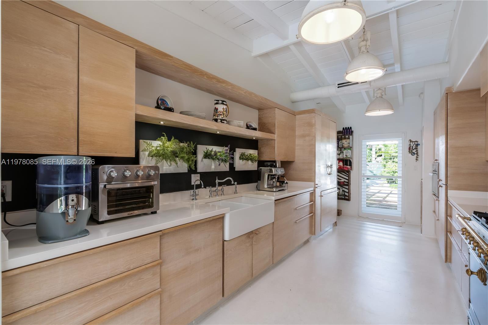 330 Gulf Road Key Biscayne, FL 33149 - Photo 22 of 46 a kitchen with stainless steel appliances a stove cabinets and a counter top space
