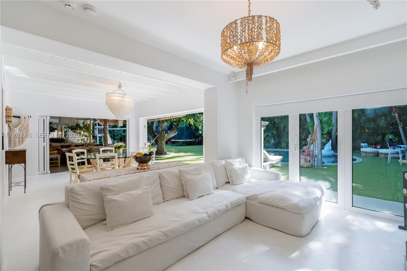 330 Gulf Road Key Biscayne, FL 33149 - Photo 24 of 46 a living room with furniture and a chandelier