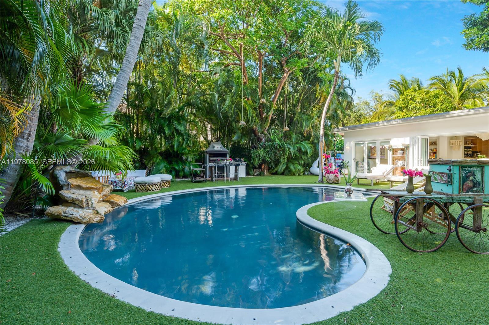 330 Gulf Road Key Biscayne, FL 33149 - Photo 36 of 46 a view of a swimming pool with lounge chair