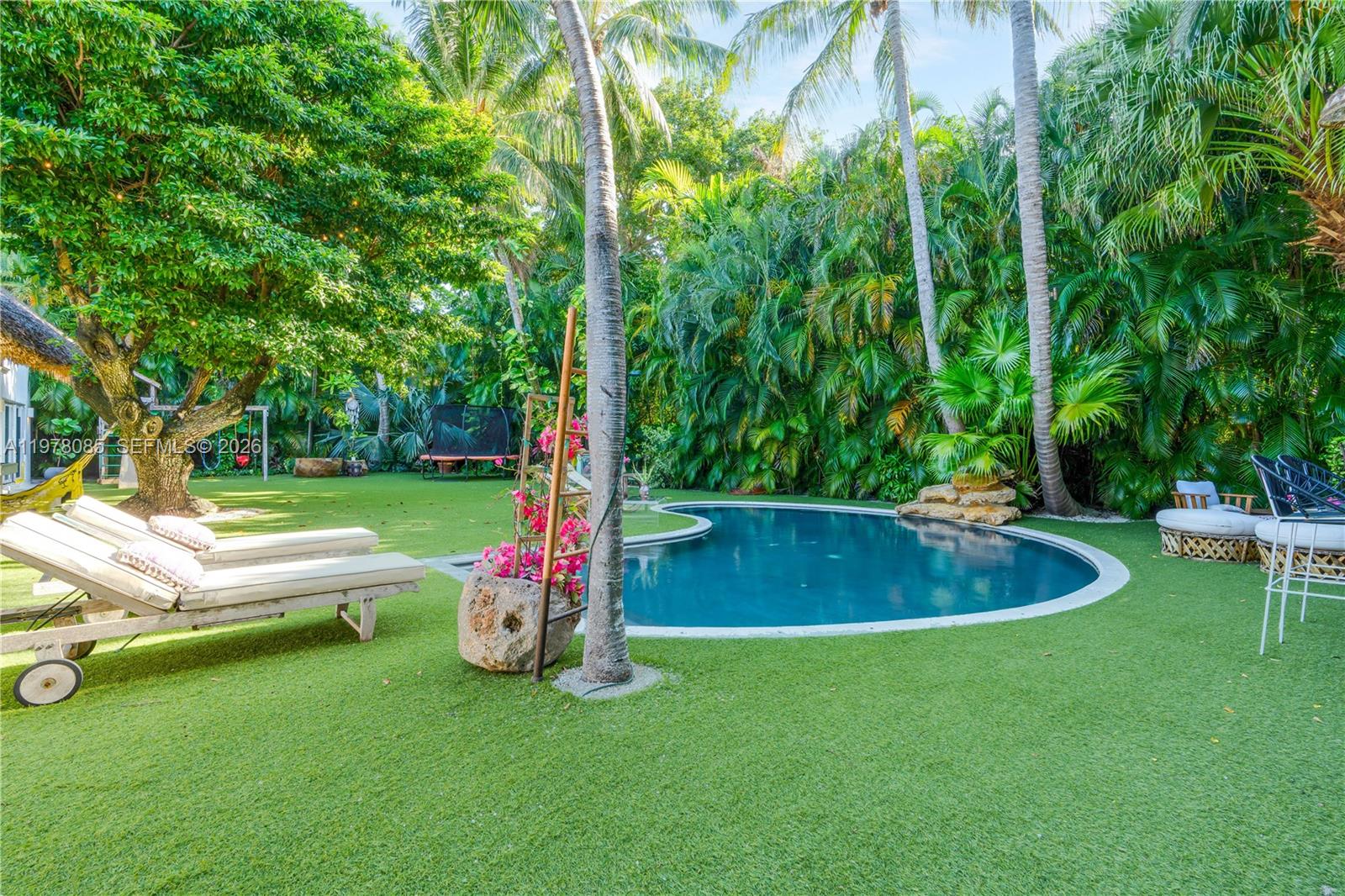 330 Gulf Road Key Biscayne, FL 33149 - Photo 38 of 46 a view of a backyard with swimming pool